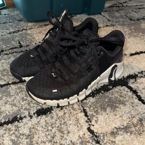 Nike Black Sneakers with White Label Detail